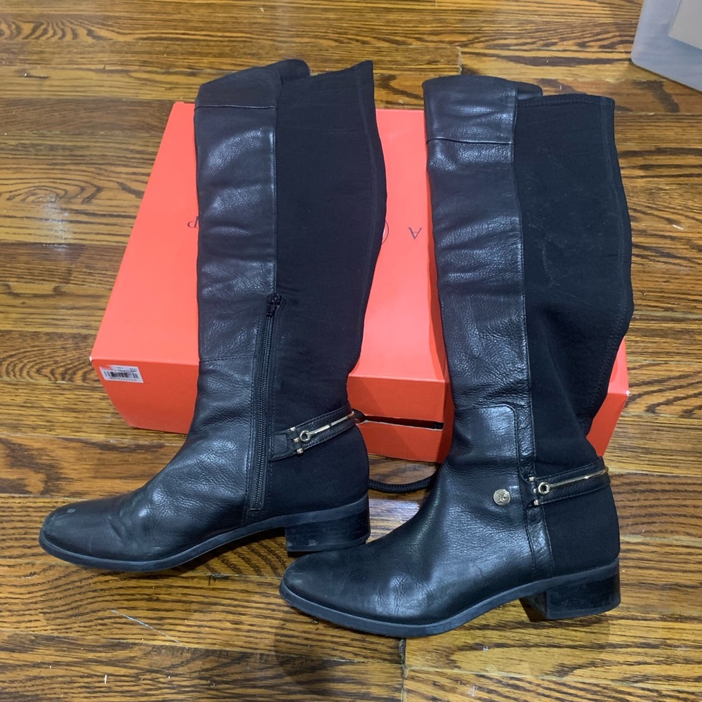 Ivanka Trump over the knee black boots.